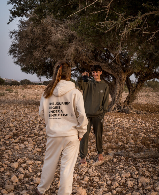 Marleen and Bodhi wearing the Freybuiter Journey hoodie and Leaf joggers